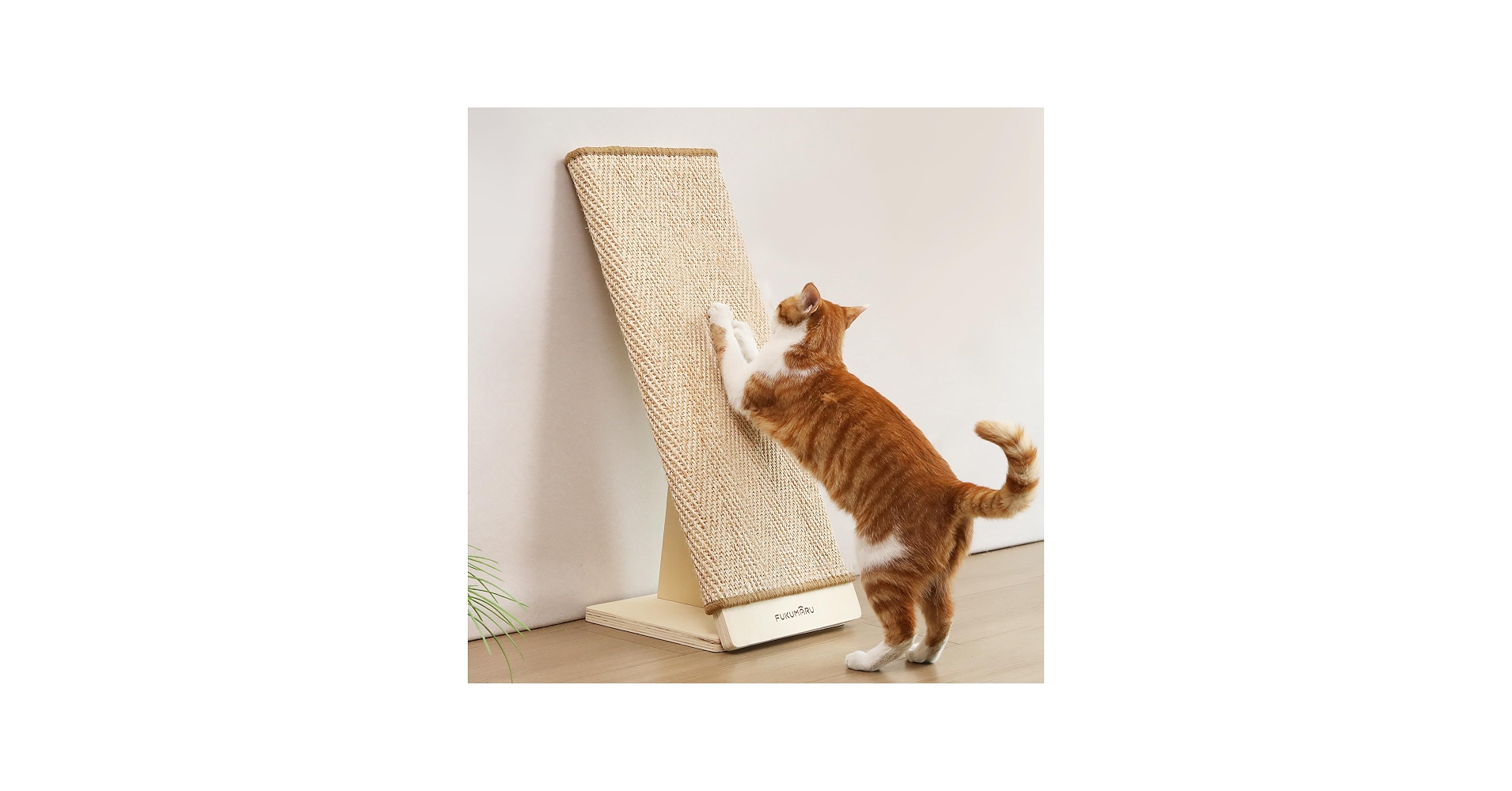 A tall sturdy scratching post with a wide heavy base placed next to a sofa